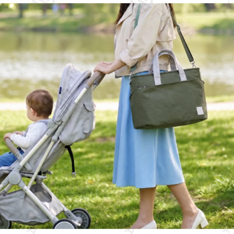 Guangzhou Fuliya Industry Co.,Ltd C-81474 Water-repellent mommy bag with insulated bottle pocket, large capacity, trolley strap, shoulder/crossbody - easy for baby outings.