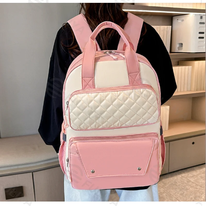 Guangzhou Fuliya Industry Co.,Ltd C-81476 This mommy bag has wet/dry pocket, insulated bottle compartment, trolley strap, comfy straps, and large capacity - great for outings.