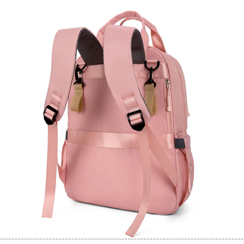 Guangzhou Fuliya Industry Co.,Ltd C-81476 This mommy bag has wet/dry pocket, insulated bottle compartment, trolley strap, comfy straps, and large capacity - great for outings.