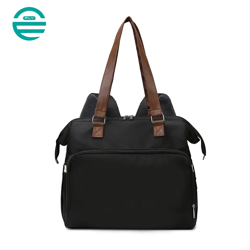 Guangzhou Fuliya Industry Co.,Ltd C-81133 Multi-functional mommy bag, water-resistant, large capacity, foil-insulated bag, wet/dry pocket, and hidden straps - hand or backpack carry with luggage strap for baby outings and travel.