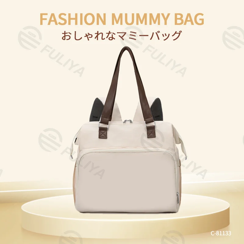 Guangzhou Fuliya Industry Co.,Ltd C-81133 Multi-functional mommy bag, water-resistant, large capacity, foil-insulated bag, wet/dry pocket, and hidden straps - hand or backpack carry with luggage strap for baby outings and travel.