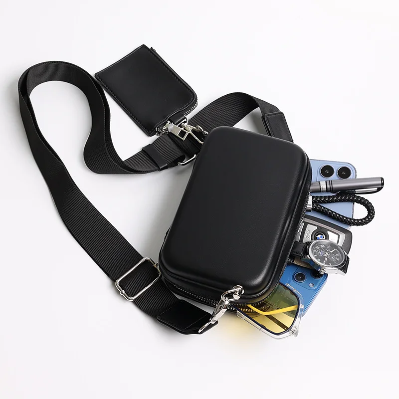 Guangzhou Fuliya Industry Co.,Ltd C-81212 Korean-style men's mini box bag, crossbody, smooth zipper, metal hardware, adjustable strap, and detachable pouch - for daily and casual use.