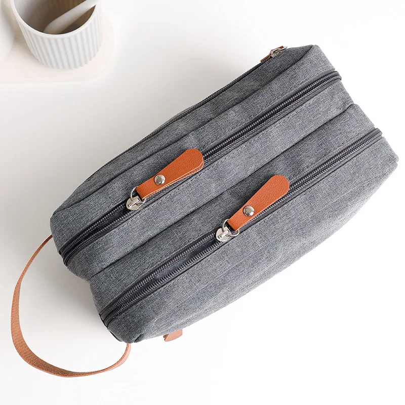 Guangzhou Fuliya Industry Co.,Ltd C-81222 Large-capacity toiletry bag, dual main compartments, leather handle, smooth zipper, and mesh pocket - carry or hang, for travel and daily use.