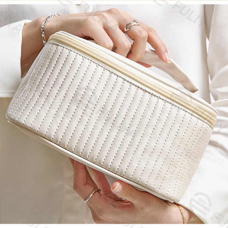 Guangzhou Fuliya Industry Co.,Ltd C-81223 PU leather large-capacity makeup bag, waterproof and easy to clean, wide opening, leather handle, brush holder, and smooth zipper - for travel and daily use.
