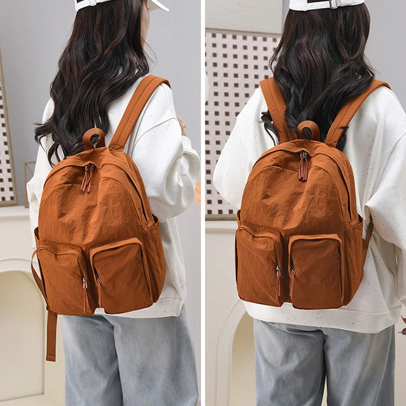 Guangzhou Fuliya Industry Co.,Ltd C-81237 Lightweight waterproof nylon backpack, large capacity with multi-layer storage, dual front zipper pockets, side pockets, inner zipper pocket, and adjustable straps - for commuting, travel, and school.