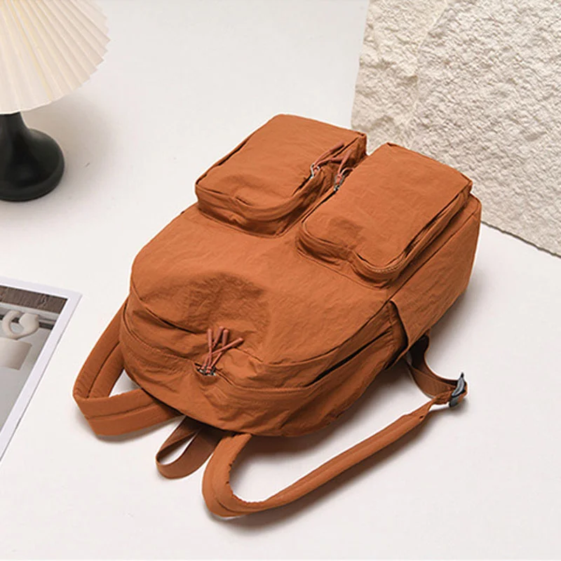 Guangzhou Fuliya Industry Co.,Ltd C-81237 Lightweight waterproof nylon backpack, large capacity with multi-layer storage, dual front zipper pockets, side pockets, inner zipper pocket, and adjustable straps - for commuting, travel, and school.