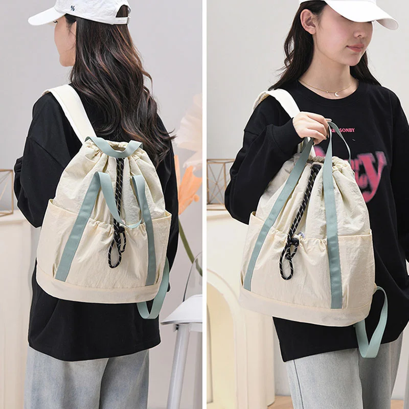 Guangzhou Fuliya Industry Co.,Ltd C-81238 Lightweight waterproof nylon drawstring backpack, large main compartment, magnetic front pocket, back zipper pocket, side pocket, adjustable straps, and comfortable handle - for cycling, gym, college, and sports.