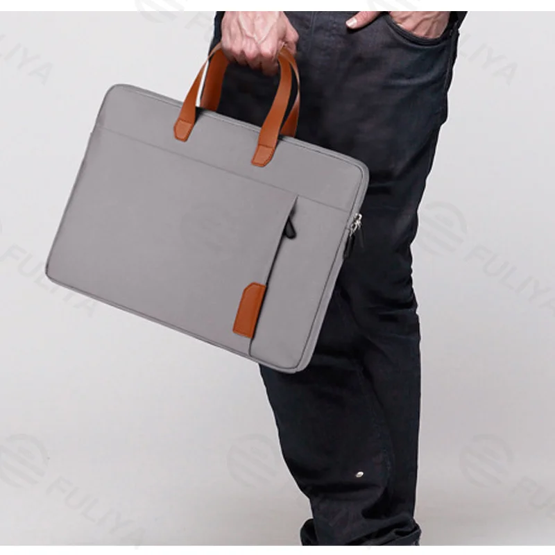 Guangzhou Fuliya Industry Co.,Ltd C-81256 Slim laptop sleeve handbag, water-resistant and scratch-resistant, thickened cotton padding, front zipper pocket, leather handle, and trolley sleeve - fits charger, mouse, and earphones for commuting and travel.