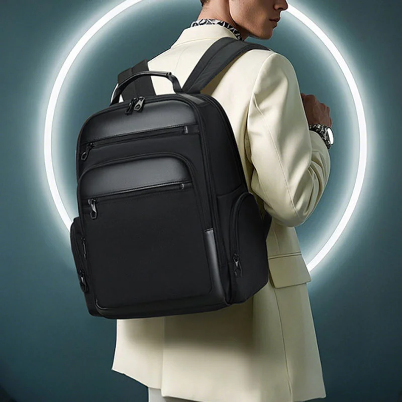 Guangzhou Fuliya Industry Co.,Ltd C-81267 Business commuter backpack, large capacity with compartments, laptop compartment, headphone jack, trolley sleeve, and breathable back panel - for commuting, business trips, and travel.