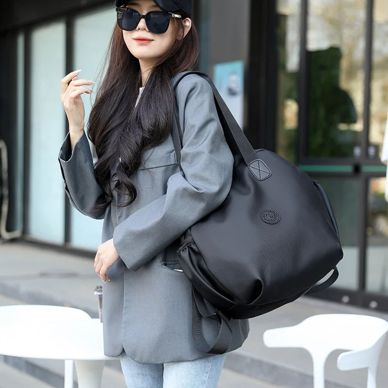 Guangzhou Fuliya Industry Co.,Ltd C-81280 Casual 2-way backpack, water-resistant PU, large main compartment with side pockets - hand, shoulder, or backpack carry for daily use and travel.