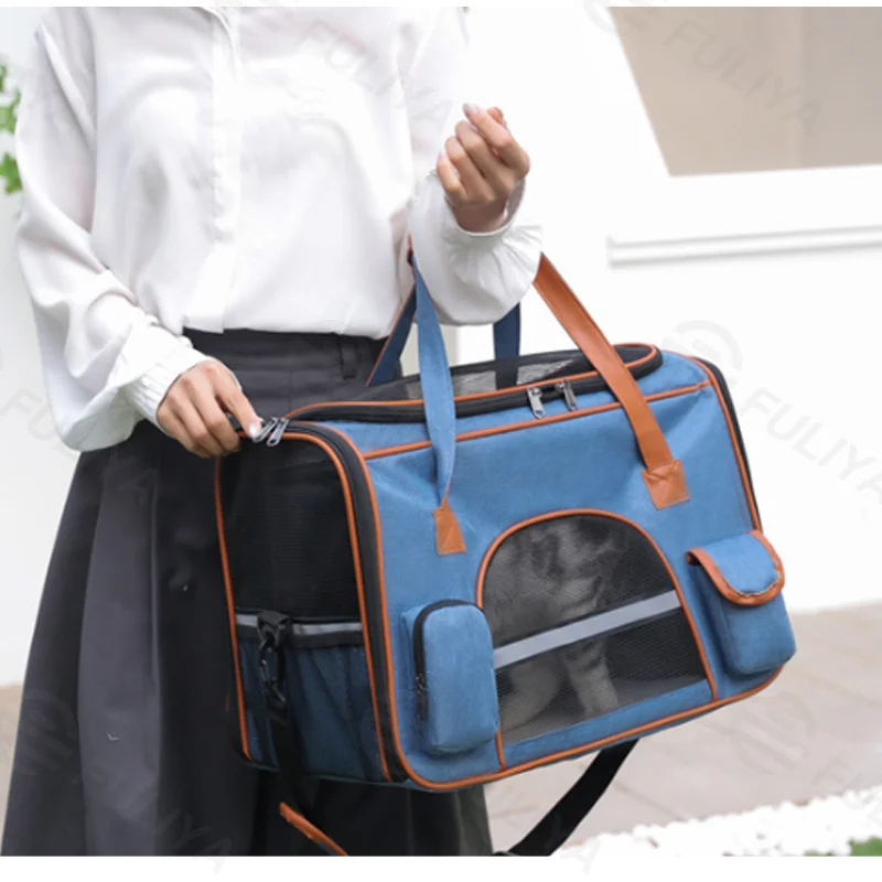Guangzhou Fuliya Industry Co.,Ltd C-81287 Portable pet carrier, fits airline under-seat, breathable mesh, easy snap buckle, smooth zipper, widened shoulder pad, and reflective strip - for cats, small dogs, and travel.