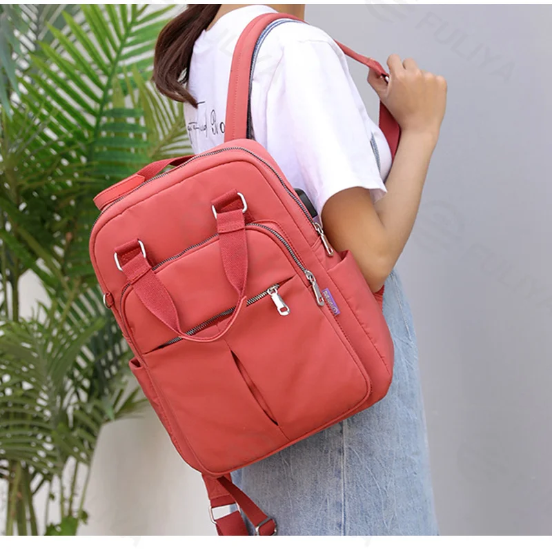 Guangzhou Fuliya Industry Co.,Ltd C-81288 Lightweight waterproof backpack, large capacity with pockets, built-in USB charging cable, anti-theft back pocket, metal D-ring, and adjustable strap - luggage pass-through for campus, commuting, and travel.