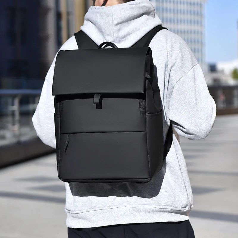 Guangzhou Fuliya Industry Co.,Ltd C-81296 Casual backpack, water-resistant, large capacity, laptop compartment, front/back zipper pockets, side pocket, and magnetic flap - for commuting and daily use.
