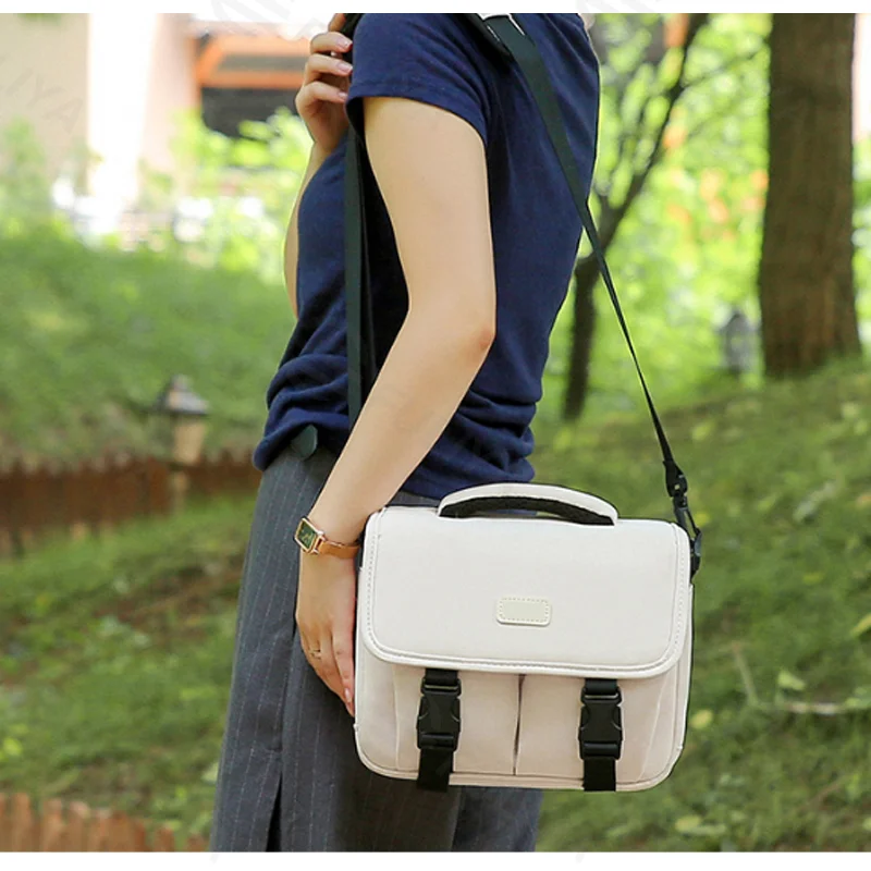 Guangzhou Fuliya Industry Co.,Ltd C-81303 Shoulder/crossbody camera bag, ergonomic shoulder strap, removable thickened dividers, multiple pockets, S/M/L sizes - for DSLR, mirrorless, and instant cameras.