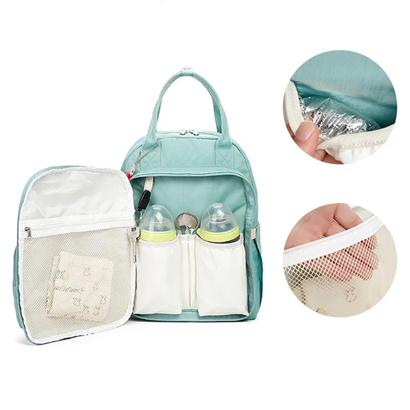 Guangzhou Fuliya Industry Co.,Ltd C-81323 Lightweight mommy backpack, water-repellent fabric, wide-opening main compartment, wet/dry separation, independent foil-insulated bottle compartment - suitable for baby outings and daily use.