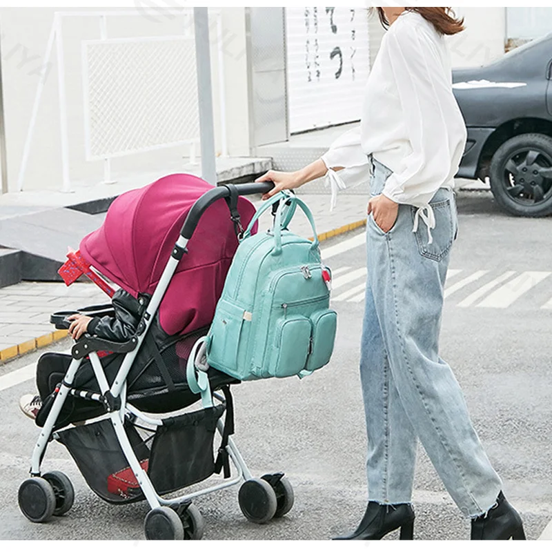 Guangzhou Fuliya Industry Co.,Ltd C-81323 Lightweight mommy backpack, water-repellent fabric, wide-opening main compartment, wet/dry separation, independent foil-insulated bottle compartment - suitable for baby outings and daily use.