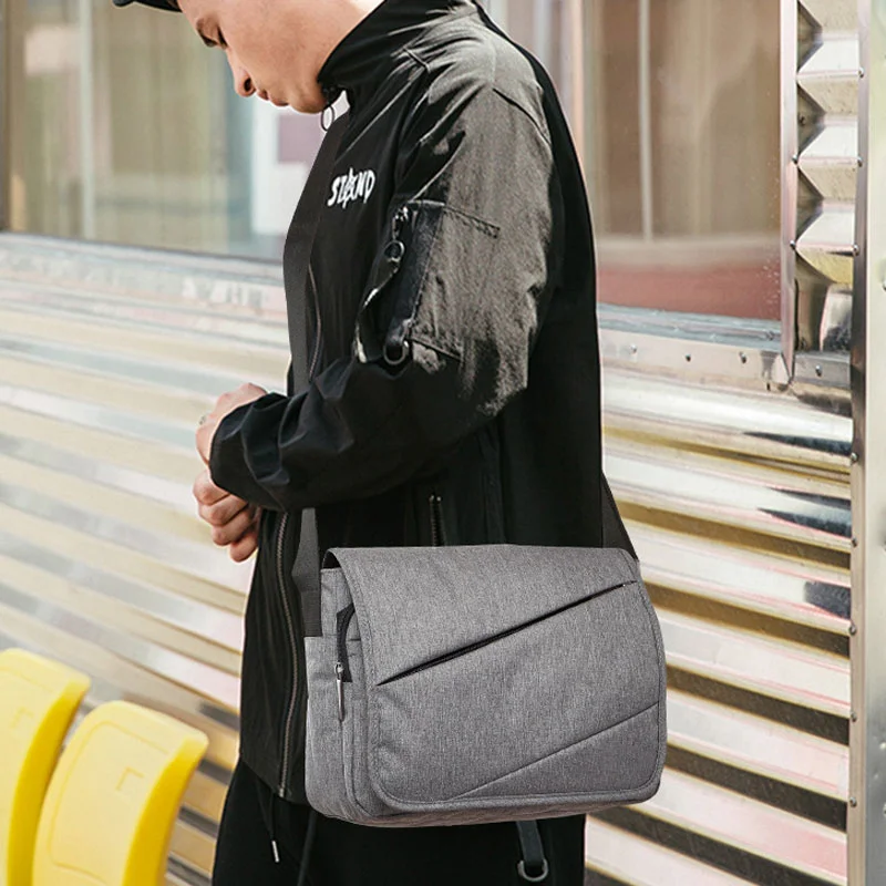 Guangzhou Fuliya Industry Co.,Ltd C-81378 This waterproof canvas crossbody bag is durable, large-capacity with multiple pockets and Velcro closure - perfect for commuting and daily use.