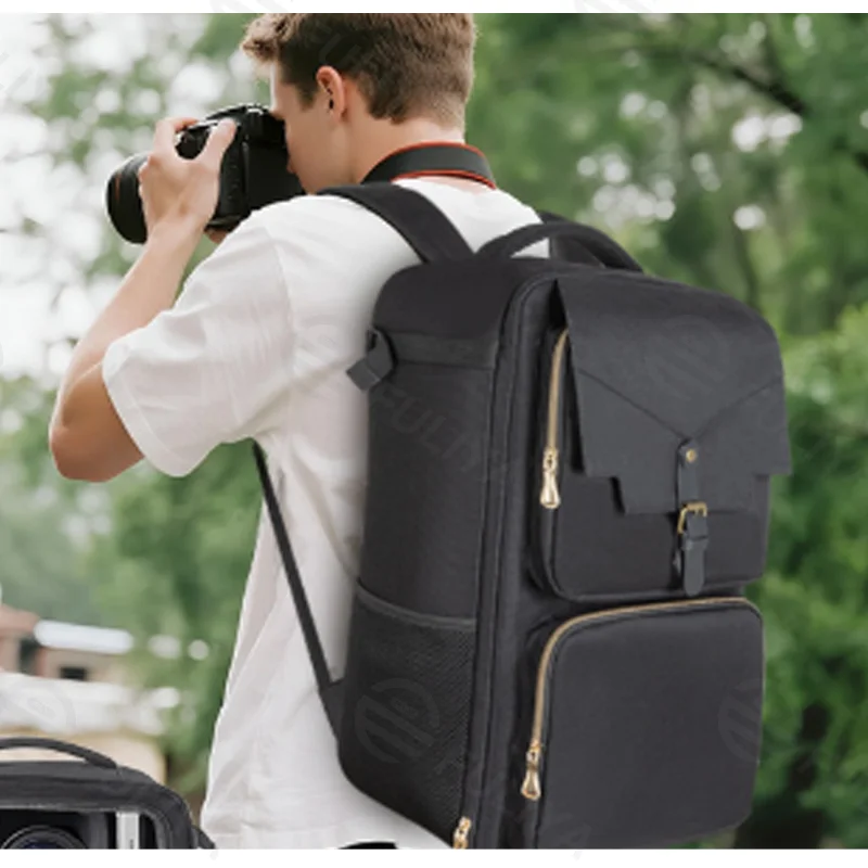 Guangzhou Fuliya Industry Co.,Ltd C-81390 This multi-functional camera backpack features DIY dividers for customizable storage, a waterproof compartment, laptop sleeve, breathable mesh, and snap/metal buckles - ideal for photography and travel.