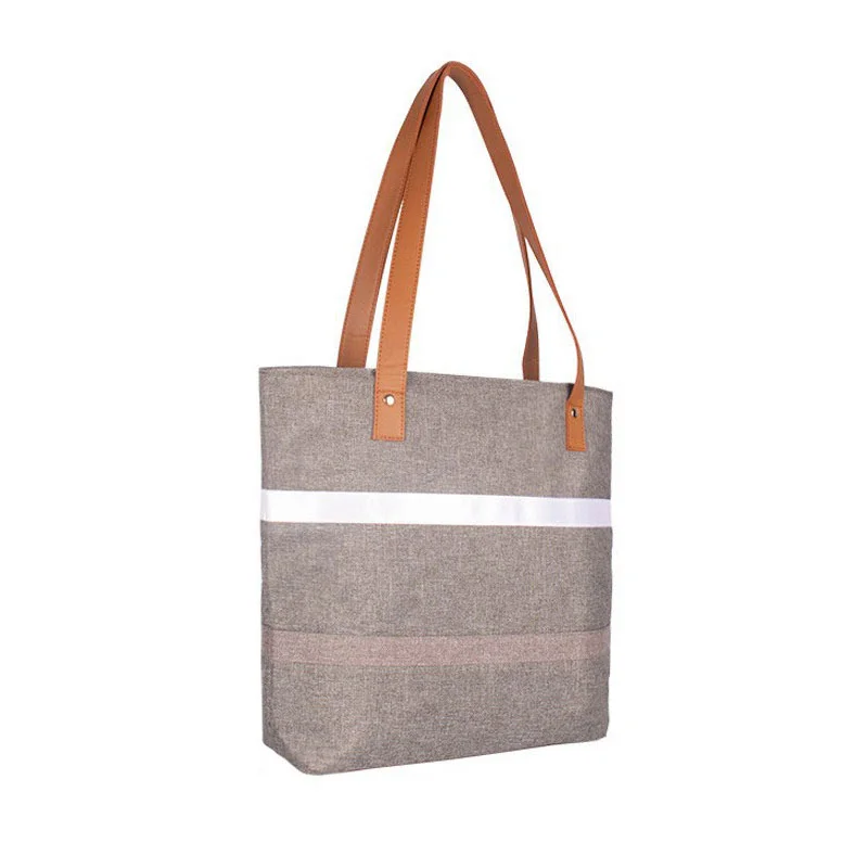 Guangzhou Fuliya Industry Co.,Ltd C-81396 Reusable striped thermal lunch tote. Compact exterior with spacious interior for lunch boxes, fruit, water bottles, and snacks. Reinforced handle for easy carry to office or picnic.