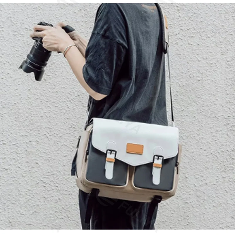 Guangzhou Fuliya Industry Co.,Ltd C-81423 This Japanese-style shoulder camera bag is waterproof and anti-theft, with widened padded straps to reduce shoulder strain, magnetic closure, and bottle pocket - for photography, travel, and commuting.