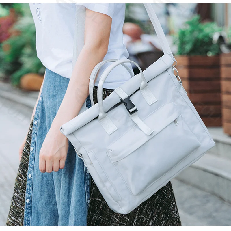 Guangzhou Fuliya Industry Co.,Ltd C-81427 This lightweight waterproof laptop bag converts between crossbody and hand carry, with dual air-cushion padding, large capacity, and trolley strap - for commuting and business trips.