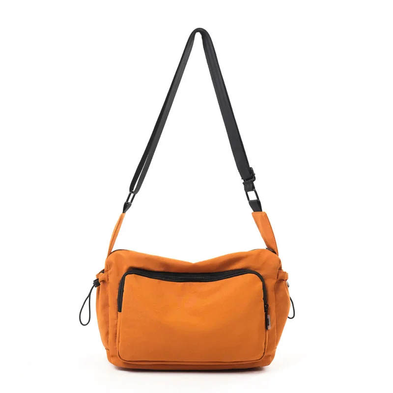 Guangzhou Fuliya Industry Co.,Ltd C-81435 This water-repellent shoulder bag has multi-layer pockets, an adjustable strap, and durable fabric - for commuting and outdoor use.