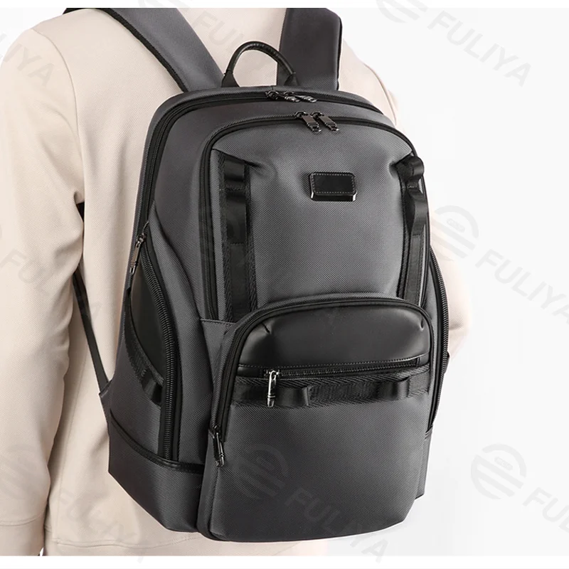 Guangzhou Fuliya Industry Co.,Ltd C-81436 This business backpack has large capacity for a 15.6″ laptop, honeycomb back pad, reflective strips, and trolley strap - for commuting and travel.