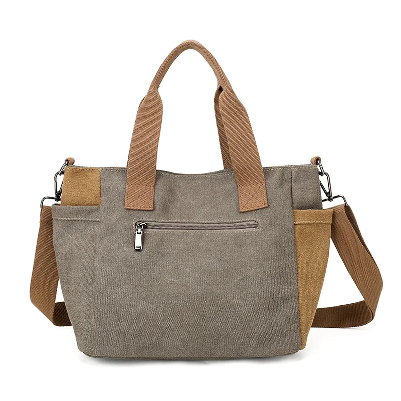 Guangzhou Fuliya Industry Co.,Ltd C-81447 This spliced canvas bag is lightweight and versatile, with hand/shoulder/crossbody carry, multi-layer pockets, adjustable strap, and side pocket - for commuting and campus.