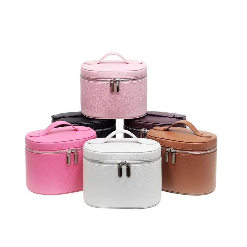 Guangzhou Fuliya Industry Co.,Ltd C-81454 This PU makeup bag features macaron colors, large capacity with compartments, smooth zipper and wide handle - for business trips, travel, and daily use.