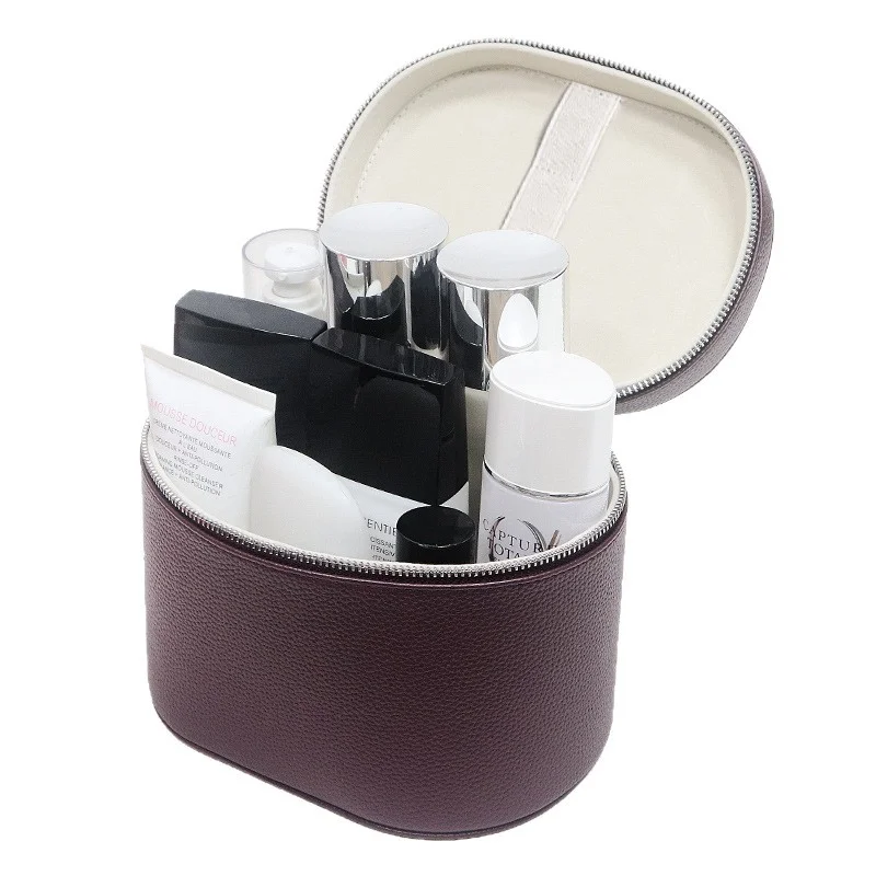 Guangzhou Fuliya Industry Co.,Ltd C-81454 This PU makeup bag features macaron colors, large capacity with compartments, smooth zipper and wide handle - for business trips, travel, and daily use.