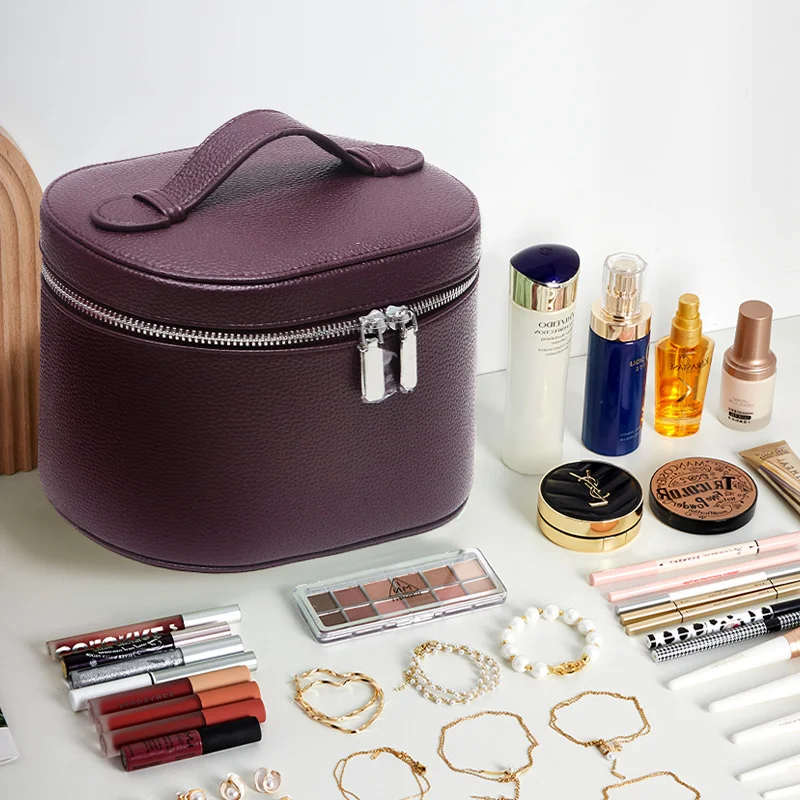 Guangzhou Fuliya Industry Co.,Ltd C-81454 This PU makeup bag features macaron colors, large capacity with compartments, smooth zipper and wide handle - for business trips, travel, and daily use.