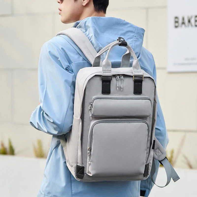 Guangzhou Fuliya Industry Co.,Ltd C-81464 This versatile backpack fits a laptop, is water-repellent and stain-resistant, includes a detachable insulated bottle pouch, and has a trolley strap - suitable for business, commuting, and family outings.