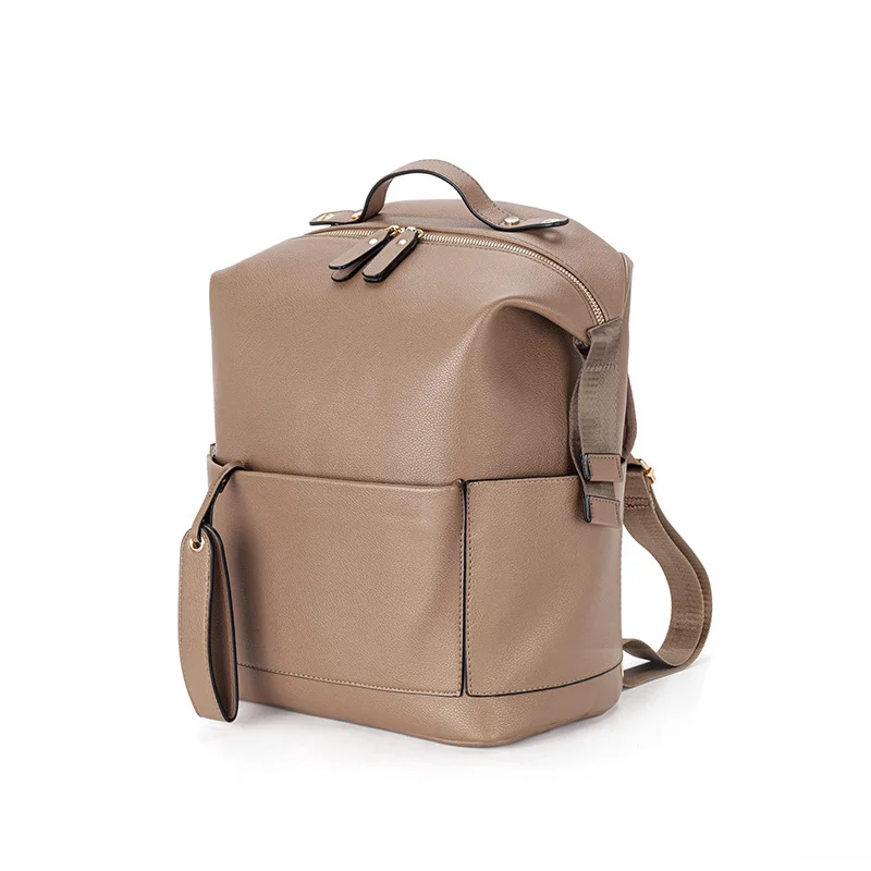 Guangzhou Fuliya Industry Co.,Ltd C-81465 This PU mommy bag offers large capacity with multiple compartments, is waterproof and easy to clean, attaches to strollers, and has comfortable shoulder straps - ideal for outings and travel with baby.