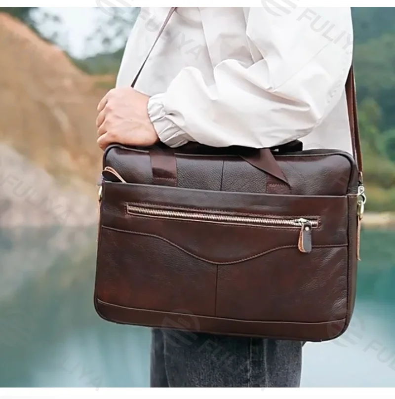 Guangzhou Fuliya Industry Co.,Ltd C-80909 Men's top-grain cowhide laptop briefcase, large capacity, laptop compartment, alloy zipper, and adjustable strap - hand, shoulder, or crossbody carry for business, commuting, and business trips.