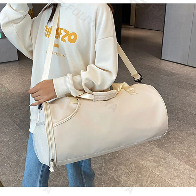 Guangzhou Fuliya Industry Co.,Ltd C-80939 Dry-wet travel duffel with shoe compartment, front zip pocket, and trolley belt. Waterproof, large capacity. For gym, sports, and weekend trips.
