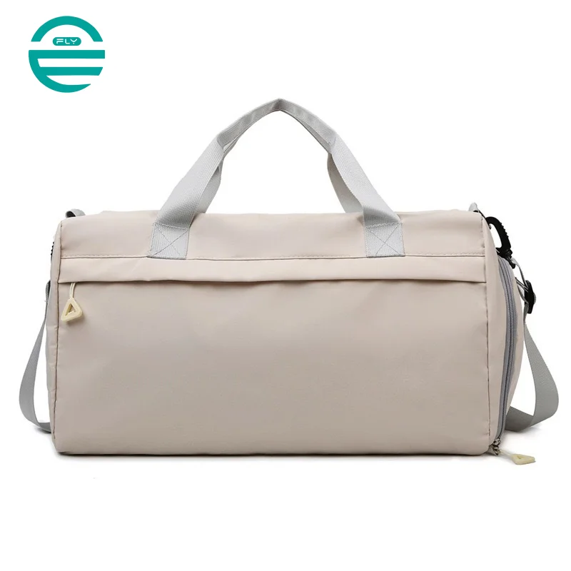 Guangzhou Fuliya Industry Co.,Ltd C-80940 Pink waterproof training travel bag with shoe compartment, front zip pocket, and trolley belt. Dry-wet separation, large capacity. For women's fitness, sports, and travel.