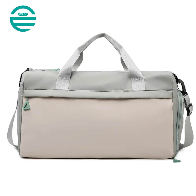 Guangzhou Fuliya Industry Co.,Ltd C-80940 Pink waterproof training travel bag with shoe compartment, front zip pocket, and trolley belt. Dry-wet separation, large capacity. For women's fitness, sports, and travel.