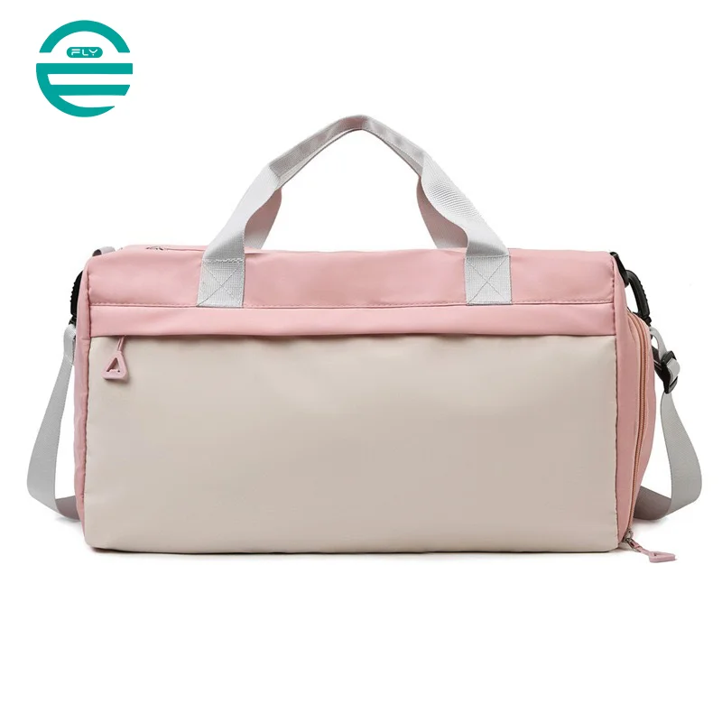 Guangzhou Fuliya Industry Co.,Ltd C-80940 Pink waterproof training travel bag with shoe compartment, front zip pocket, and trolley belt. Dry-wet separation, large capacity. For women's fitness, sports, and travel.