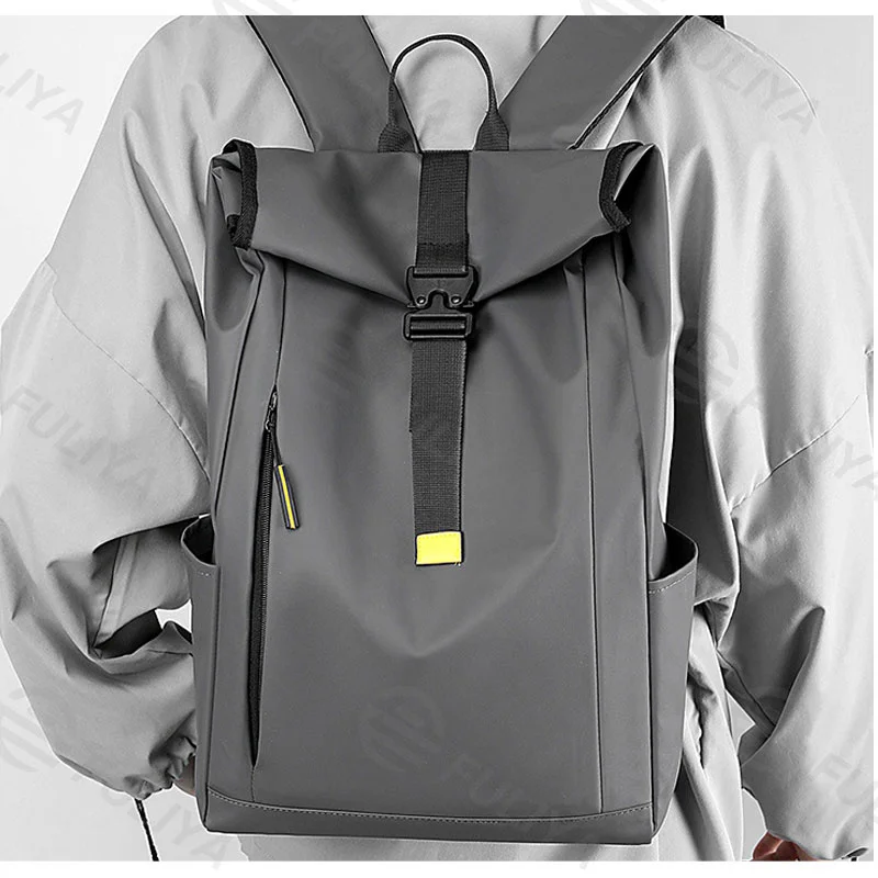 Guangzhou Fuliya Industry Co.,Ltd C-80944 Men's roll-top backpack with multi-layer large capacity . Features breathable shoulder straps and a trolley sleeve for easy carry. For business trips, short travel, and commuting.
