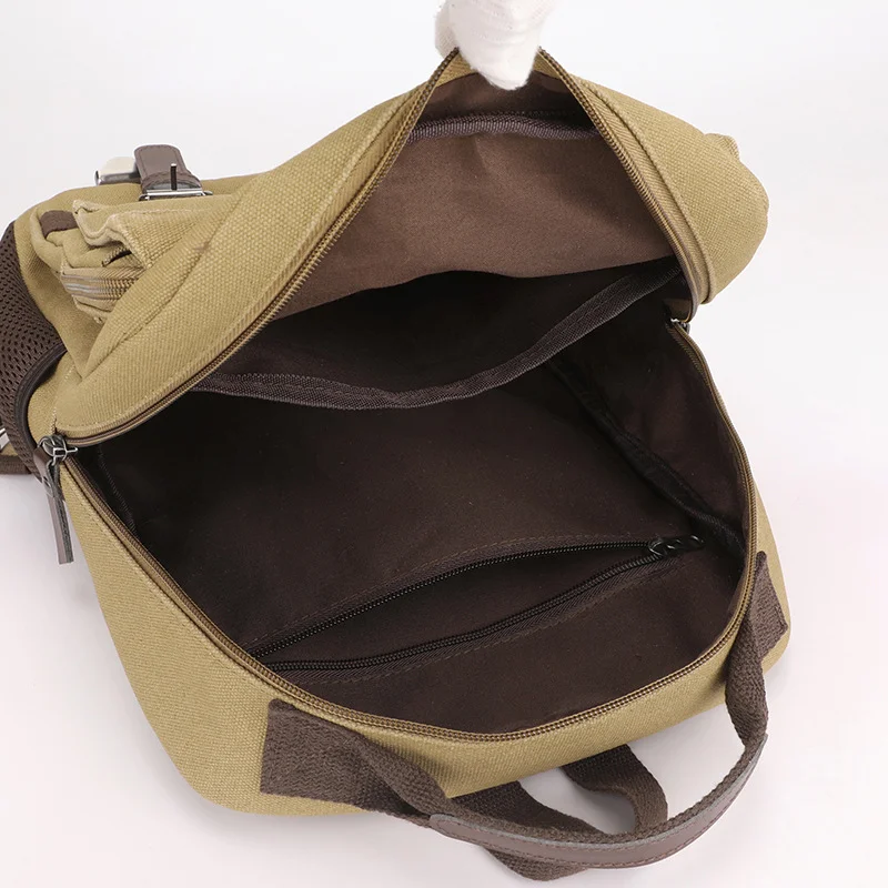 Guangzhou Fuliya Industry Co.,Ltd C-80986 Retro canvas multi-function backpack with large multi-layer storage. Zipper and hook straps support backpack, shoulder, hand carry, and left/right switching. For school, commuting, and travel.