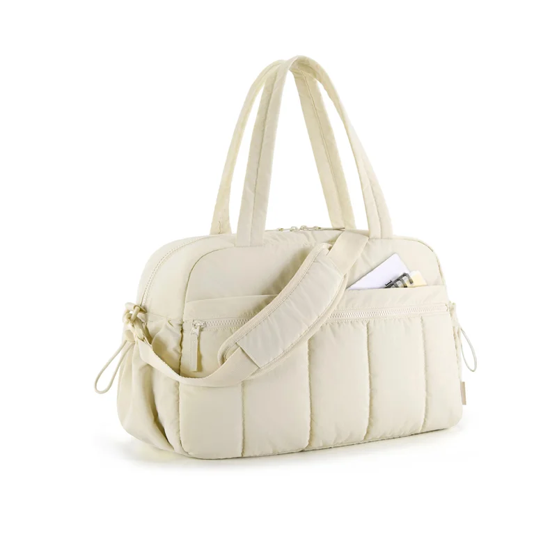 Guangzhou Fuliya Industry Co.,Ltd C-80993 Lightweight quilted sports travel bag with wet/dry PVC pocket. Multi-pockets, padded strap, and trolley sleeve. Hand/shoulder/crossbody carry. For gym, swimming, and short trips.