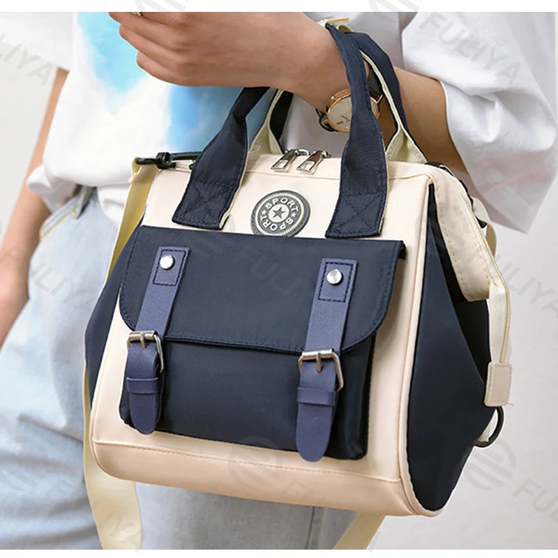 Guangzhou Fuliya Industry Co.,Ltd C-81028 Waterproof diaper bag, large capacity with multi-layer storage, separate bottle compartments, double zipper, detachable strap, and stroller straps - hand, shoulder, or backpack carry for baby outings and travel.