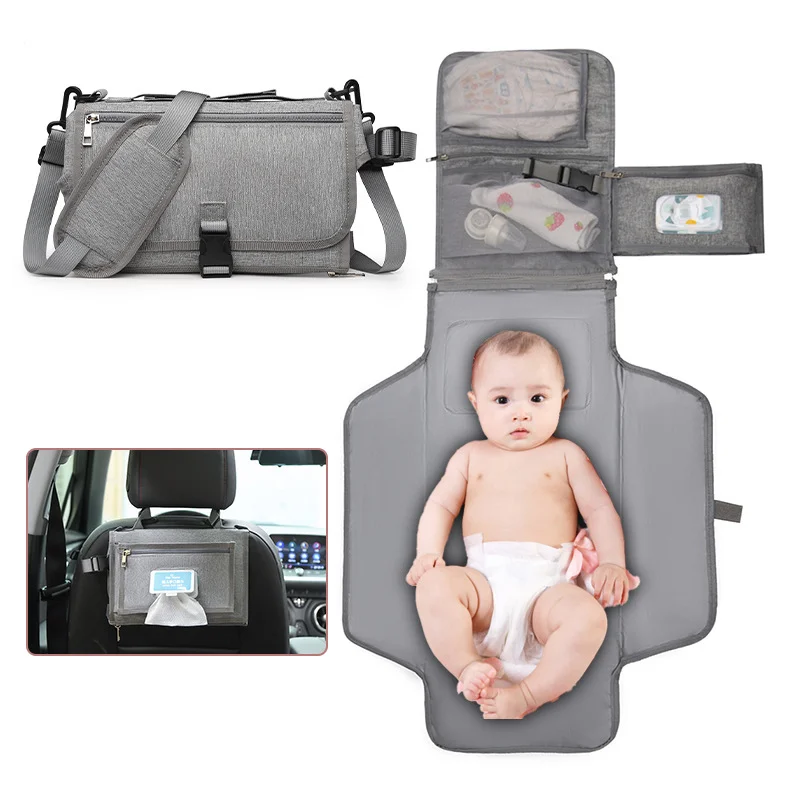Guangzhou Fuliya Industry Co.,Ltd C-81029 Portable baby changing pad bag, multi-functional foldable design, changing mat, storage pockets, tissue dispenser, zipper pocket, and handle - attaches to stroller or car for easy travel.