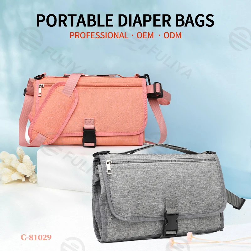 Guangzhou Fuliya Industry Co.,Ltd C-81029 Portable baby changing pad bag, multi-functional foldable design, changing mat, storage pockets, tissue dispenser, zipper pocket, and handle - attaches to stroller or car for easy travel.
