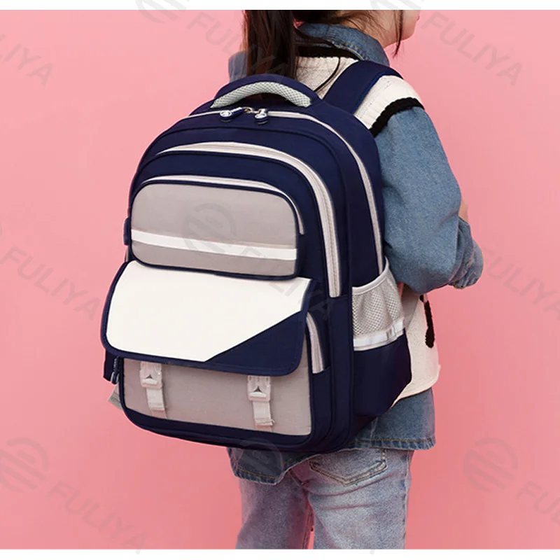 Guangzhou Fuliya Industry Co.,Ltd C-81048 Student backpack, water-resistant, large capacity, front pocket, side mesh pocket, adjustable strap, and breathable soft back pad - for children and primary/middle school students.