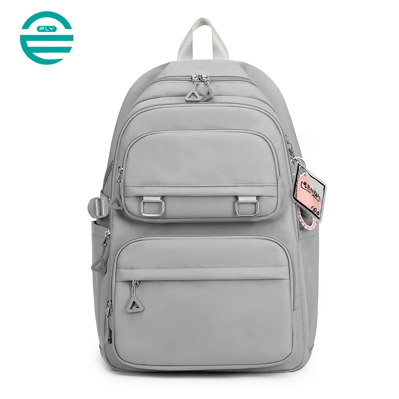 Guangzhou Fuliya Industry Co.,Ltd C-81050 Student load-reducing backpack, lightweight nylon, large capacity, front/side pockets, adjustable strap, spine-protecting back pad, and luggage strap - for primary and middle school students.